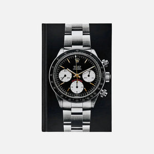 Cover of the book 'A Man And His Watch' featuring an iconic Rolex Daytona watch.