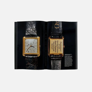 Open pages of "A Man And His Watch" book showcasing vintage wristwatches.