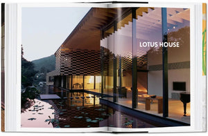 Open book displaying modern Japanese architecture with a reflective water feature and glass walls, highlighting traditional Japanese aesthetics in contemporary design.